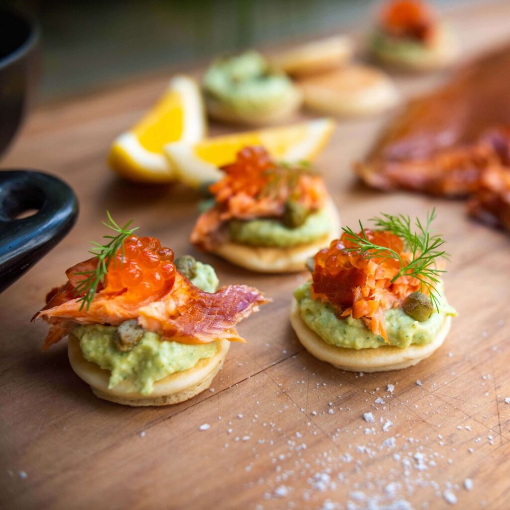 Salmon blinis with avocado crème fraîche